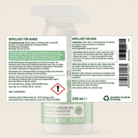 Etikett eines Abwehrsprays für Hunde, das für den Schutz vor Zecken und anderen Parasiten sorgt. Das Spray enthält ätherische Öle wie Nachtkerzenöl, Lavendelöl und Geraniol, und die Anwendung erfolgt durch Sprühen auf verschiedene Körperbereiche des Hundes, z.B. Pfoten und Bauch.