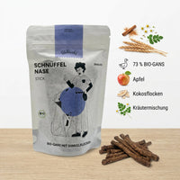 Poodlewohl Bio-Gans Stickis Rezepturbild mit 73 Prozent Bio-Gans, Dinkelflocken, Apfel, Kokosflocken und Kräutermischung