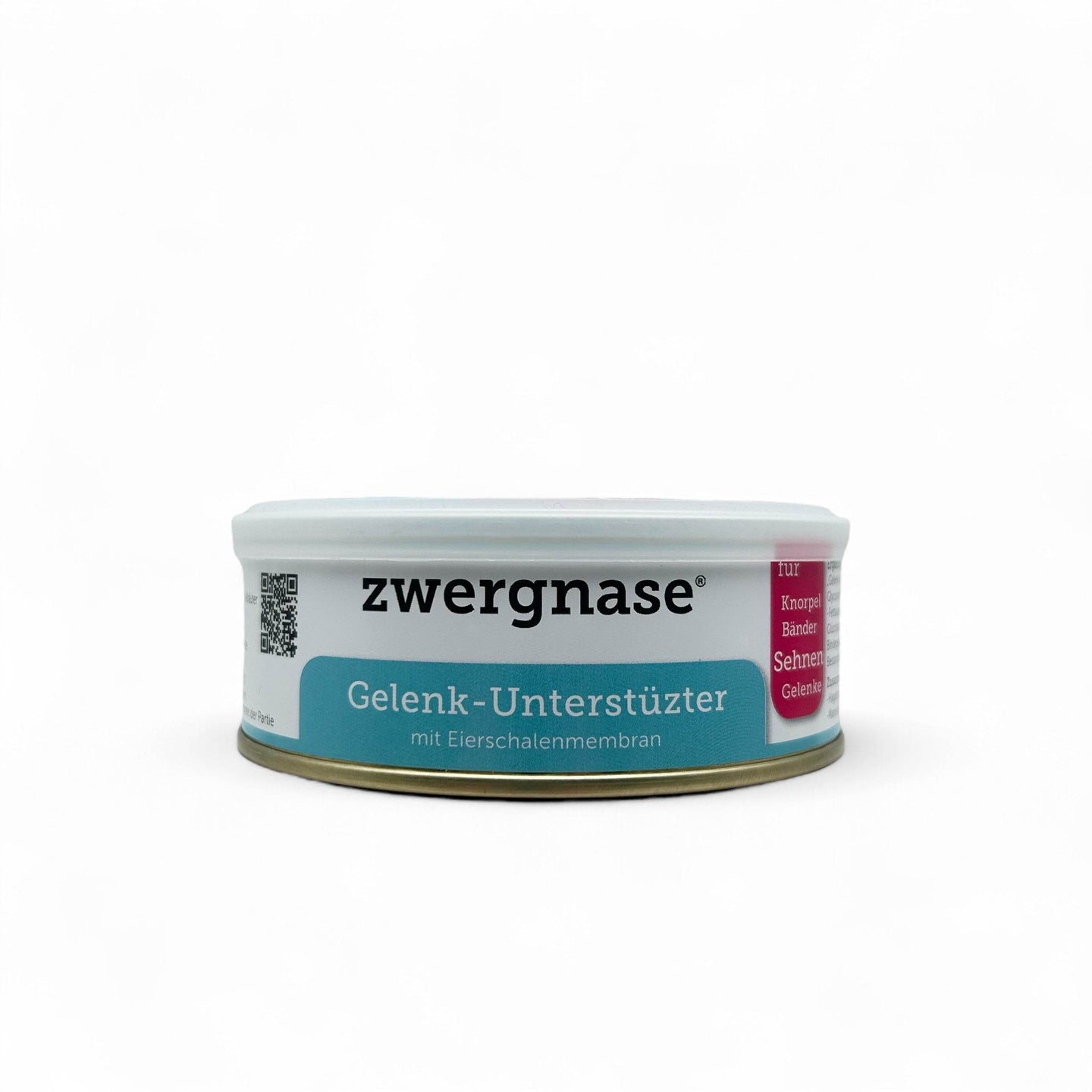 Dose des Gelenk-Unterstützers für Hunde und Katzen mit natürlichem Pulver zur Unterstützung der Gelenkgesundheit – auf einem hellen Untergrund mit einigen pflanzlichen Zutaten wie Hagebutte und Ingwer dekoriert.