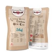 Verpackung von HerzensHund Bio-Schaf in einem Beutel mit Zucchini, Aprikose, Buchweizen, Salat und Apfel. Auf der Rückseite sind die Nährwertangaben und die Inhaltsstoffe aufgeführt.