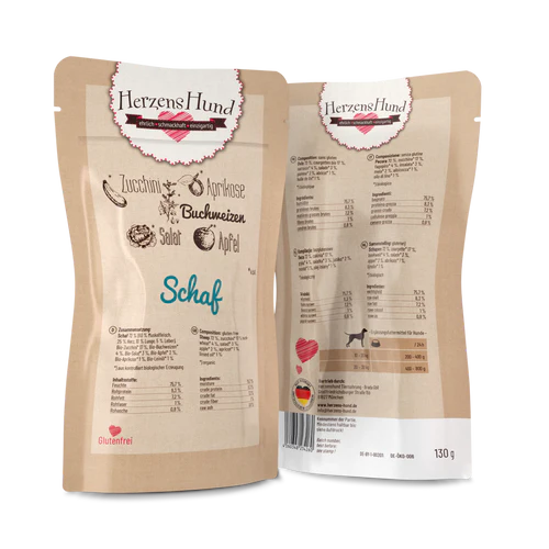 Verpackung von HerzensHund Bio-Schaf in einem Beutel mit Zucchini, Aprikose, Buchweizen, Salat und Apfel. Auf der Rückseite sind die Nährwertangaben und die Inhaltsstoffe aufgeführt.