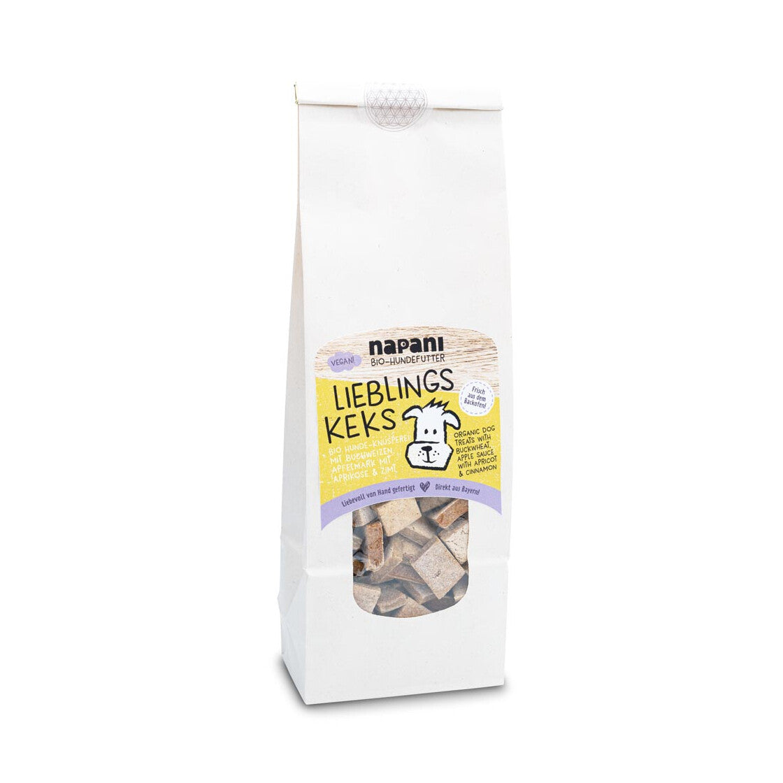Im umweltfreundlich verpackten Beutel mit veganen Bio-Hundekeksen von Napani, liebevoll von Hand gebacken in Bayern, mit Buchweizen, Apfelmark, Aprikose und Zimt – glutenfrei und ohne künstliche Zusätze