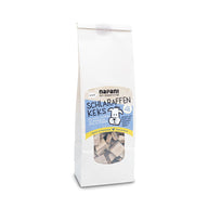 Schlaraffen-Kekse für Hunde – knusprige, vegane Hundesnacks mit Bio-Buchweizen, Apfel und Petersilie, verpackt in kompostierbaren Beuteln aus pflanzlichen Materialien.