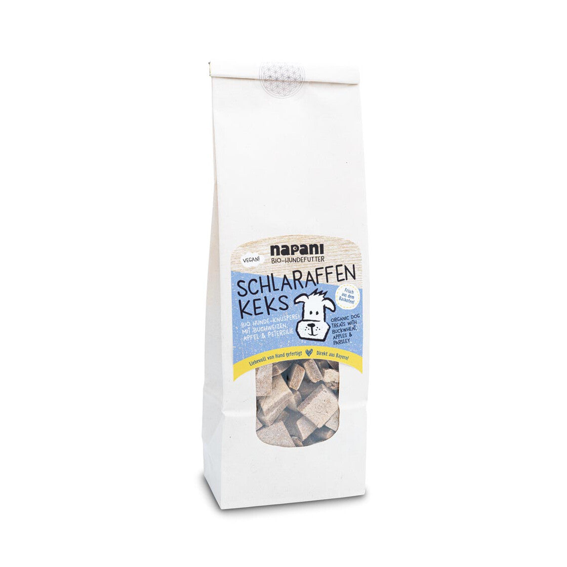 Schlaraffen-Kekse für Hunde – knusprige, vegane Hundesnacks mit Bio-Buchweizen, Apfel und Petersilie, verpackt in kompostierbaren Beuteln aus pflanzlichen Materialien.